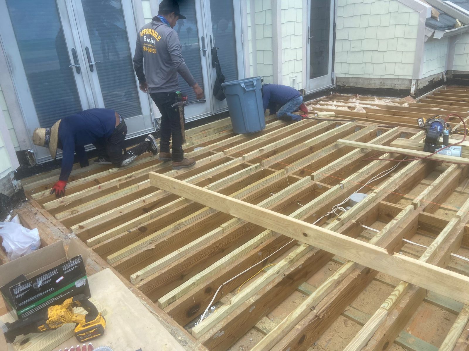Redbird carpenters framing new floor structure during a whole-home renovation